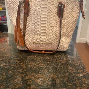 Dooney and bourke purse with matching wallet.